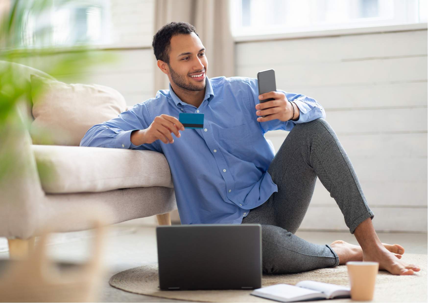 Young man reviewing debit card transactions with CardValet