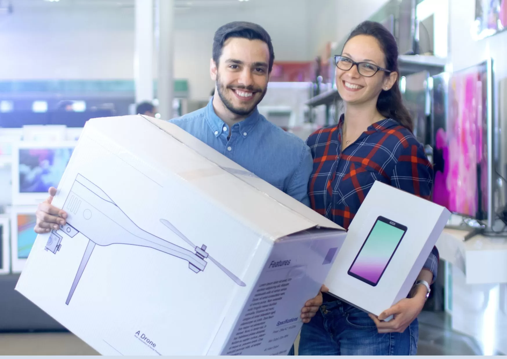 Couple with a drone and tablet